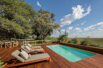 take a dip in the pool at Camp Moremi while watching the wildlife in the savannah below