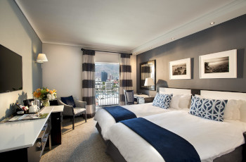  Relaxing rooms with views over the harbour at the Commodore Hotel
