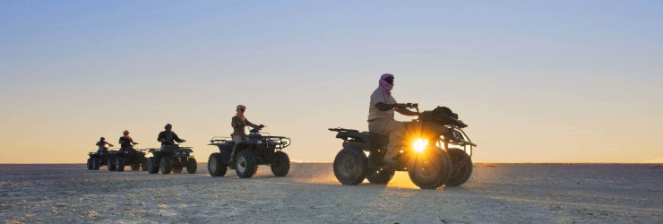  Quad biking across the pans at sunset, Jack's Camp