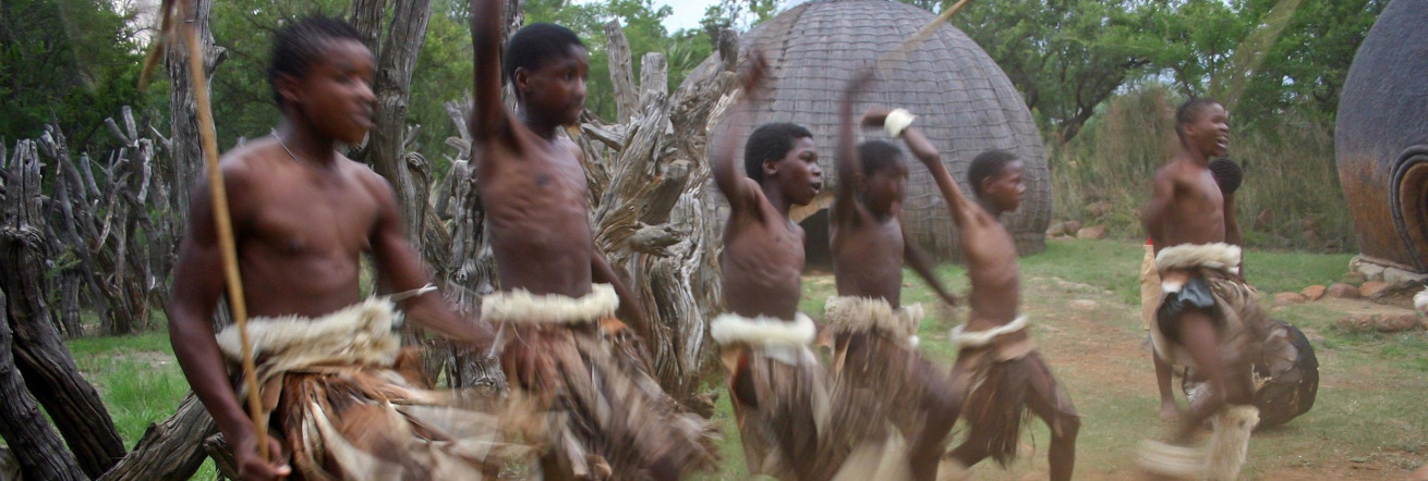 Traditional dancing and huts in Zululand
