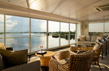  The lounge area on the Zambezi Queen, beautiful views out over the river