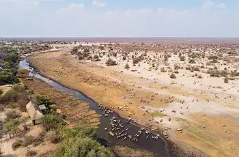 Aerial view of Leroo La Tau Lodge with a view over the Boteti River