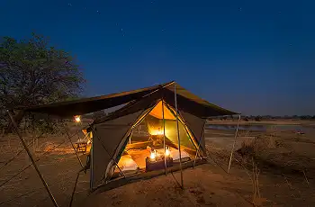 Lanterns light up the camp at night