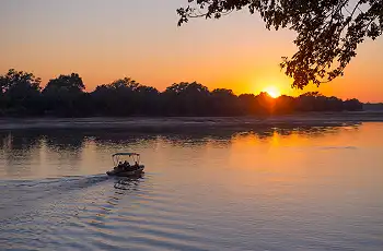 Cruise along the Luangwa River at sunset