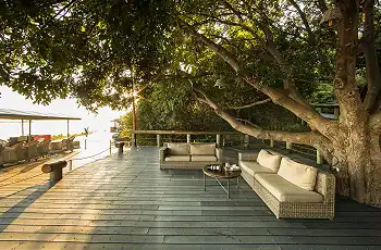 Relax on the deck overlooking the Chobe River at Chobe Game Lodge