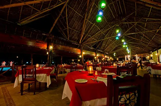 Dining area at night at the Blue Bay Resort