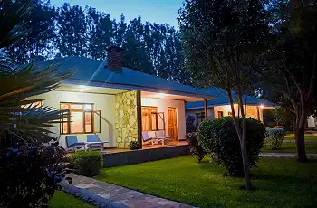 The peaceful gardens light up at night at Country Lodge Karatu