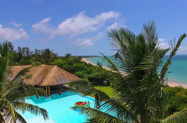 Relax by the swimming pool overlooking the ocean