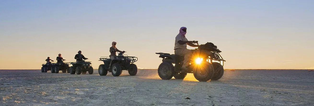 Quad biking across the pans at sunset, Jack's Camp