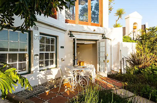 Relax on your patio at the Farmhouse Hotel