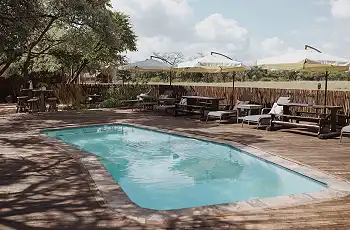 Relax by the pool at the lodge in the afternoon