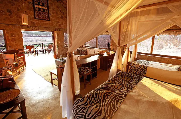The sun streaming into your luxury chalet at Ruaha River Lodge