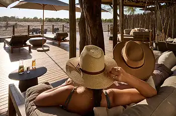 Relax on the deck in the main area and watch the wildlife come past at Savute Safari Lodge