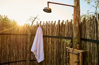 Outside showers are a feature to the rooms at Savute Safari Lodge