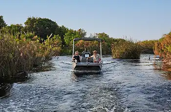 Boating through the channels of the Okavango, Xugana Island Lodge, Botswana