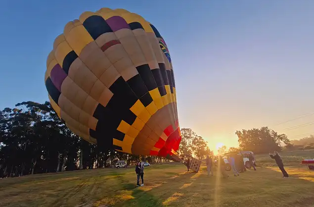Taking off as the sun rises over the Cape Winelands