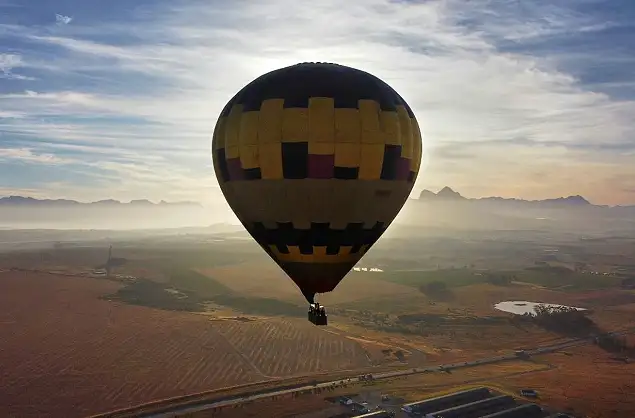 Floating over the winelands with the Cape mountains in the distance