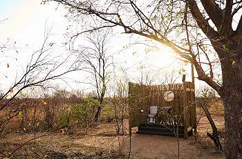 Open air bathrooms with views of the surrounding bush