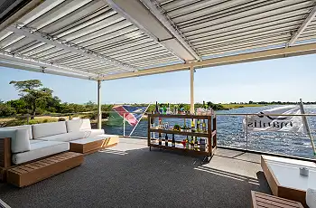 Enjoy a sundowner on the back deck of the houseboat